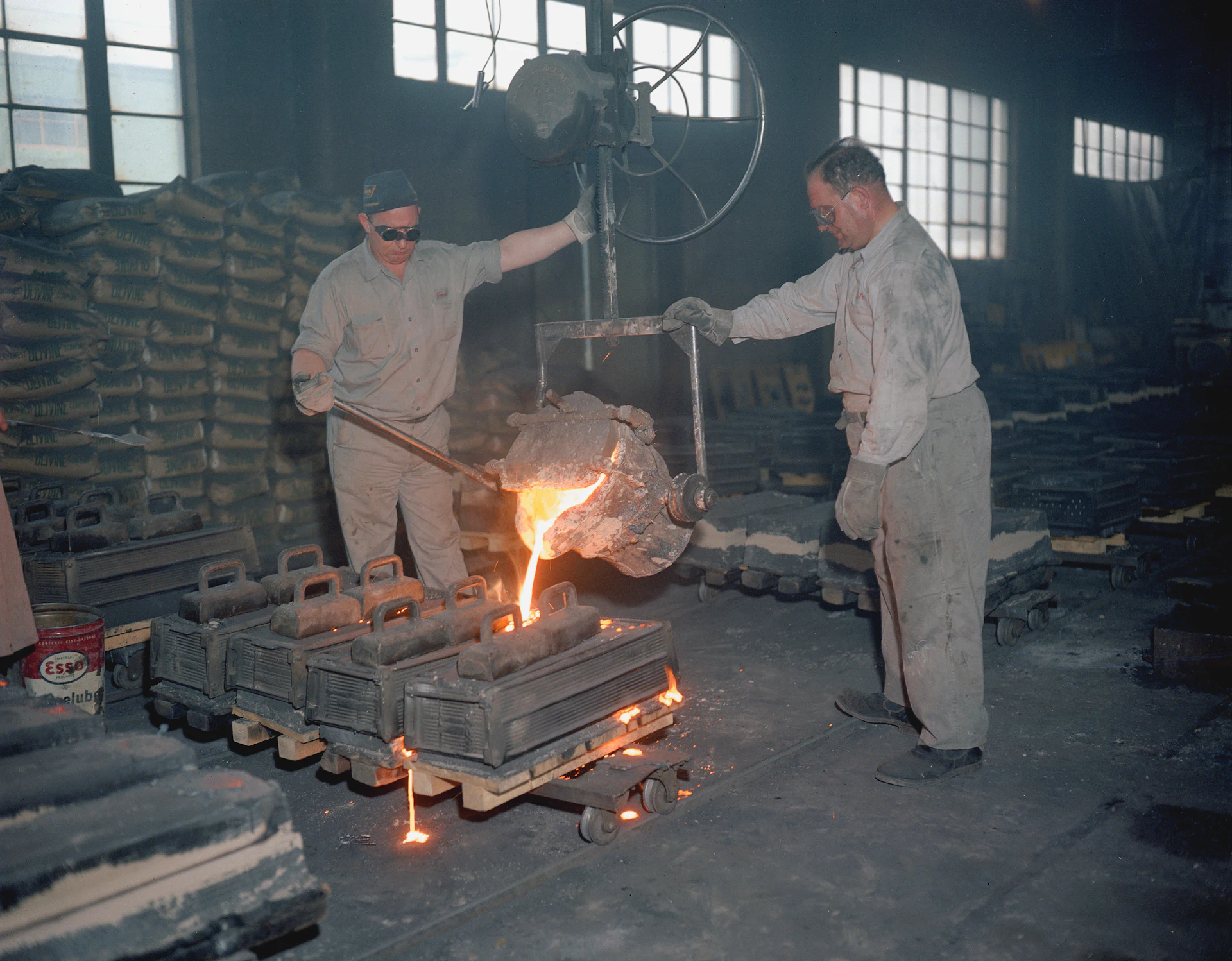 Fabricators working on a heavy steel assembly