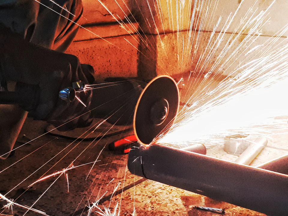 Sparks flying from steel being ground