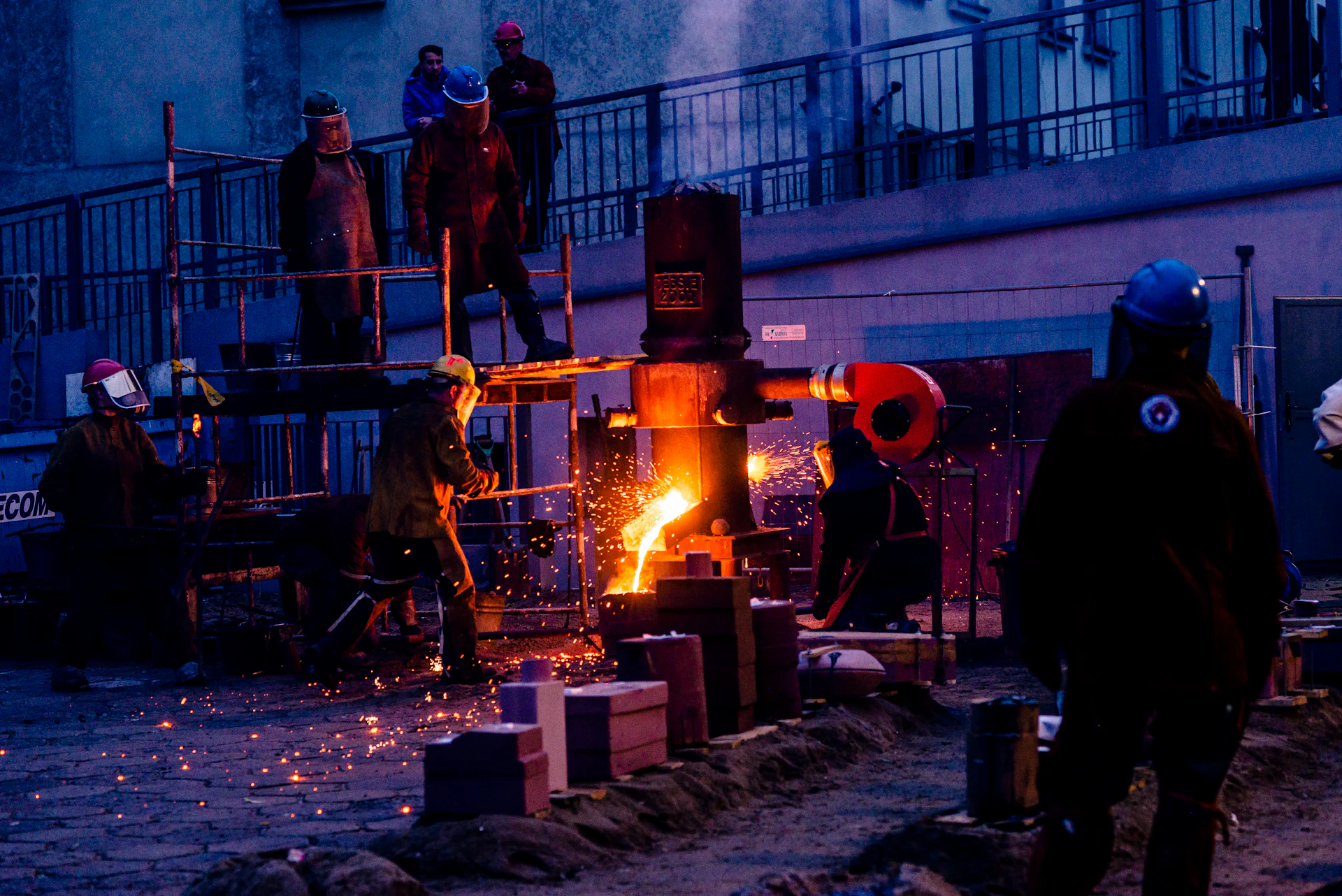 Molten alloy being poured on the furnace floor